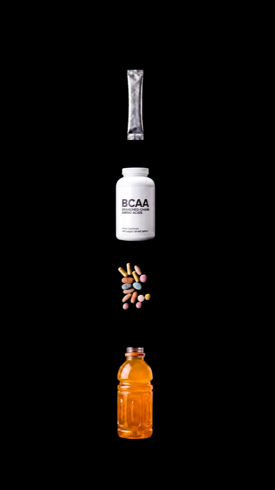Four supplements on black background: silver packet, white BCAA bottle, colorful pills, orange sports drink bottle
