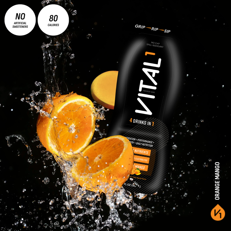 Vital1 Orange Mango drink pouch, "4 Drinks in 1," 80 calories, no artificial sweeteners, with splashing oranges on black background.