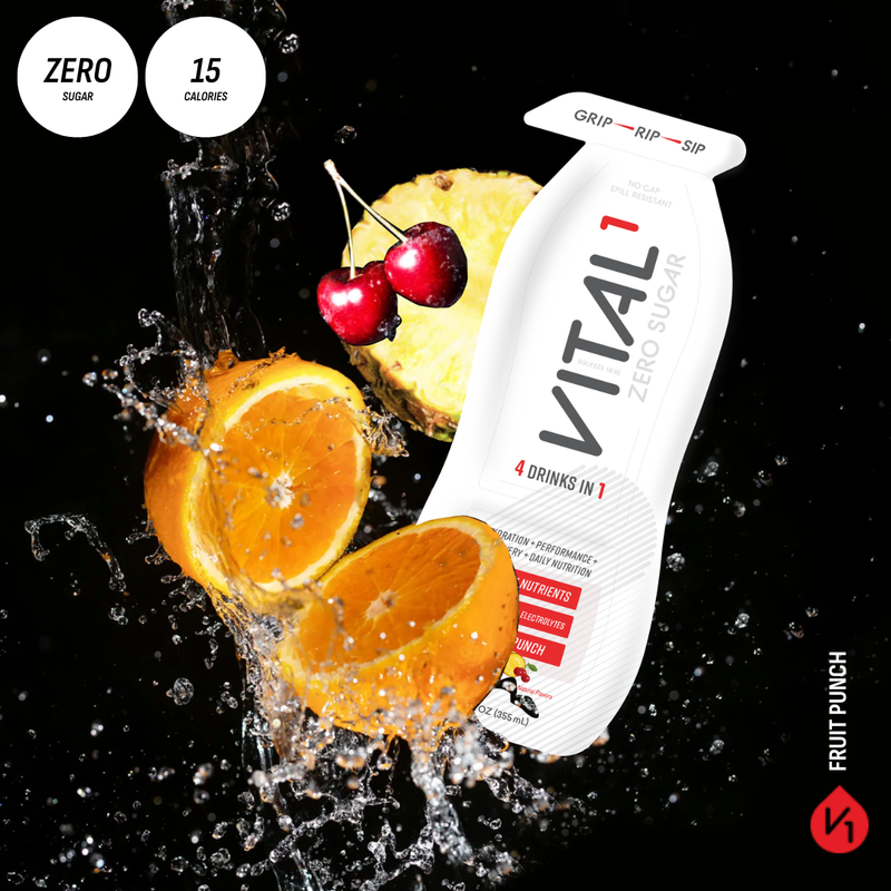 Vital1 Zero Sugar Fruit Punch bottle with splashing oranges, cherries, and pineapple; "4 Drinks in 1, Zero Sugar, 15 Calories"