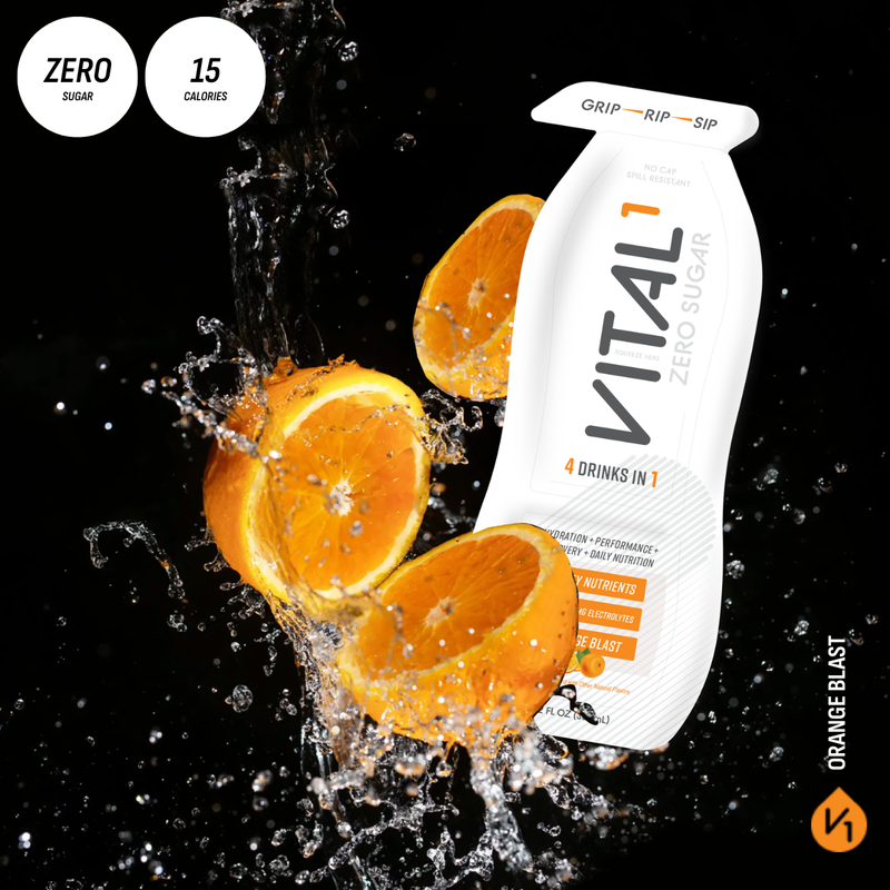 Vital1 Zero Sugar Orange Blast drink pouch, "4 Drinks in 1," with splashing oranges on black background, zero sugar, 15 calories